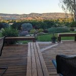 From my vantage point, I can enjoy the deck, the landscaping, and the Boise Mountains all in one panoramic shot.